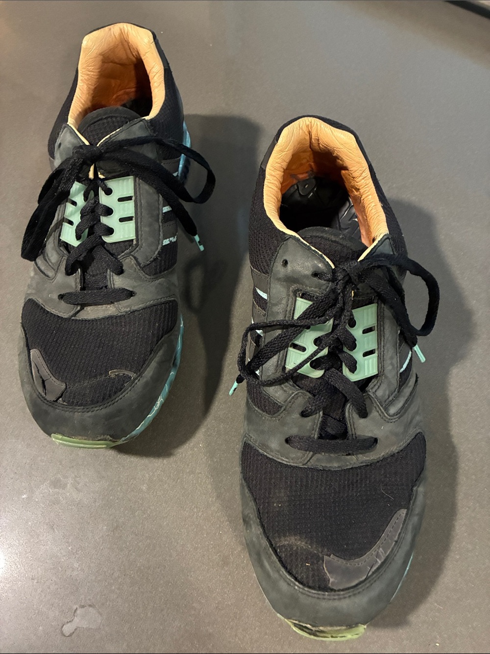 Adida’s Star Wars Emperor Black and Mint Athletic Sneakers